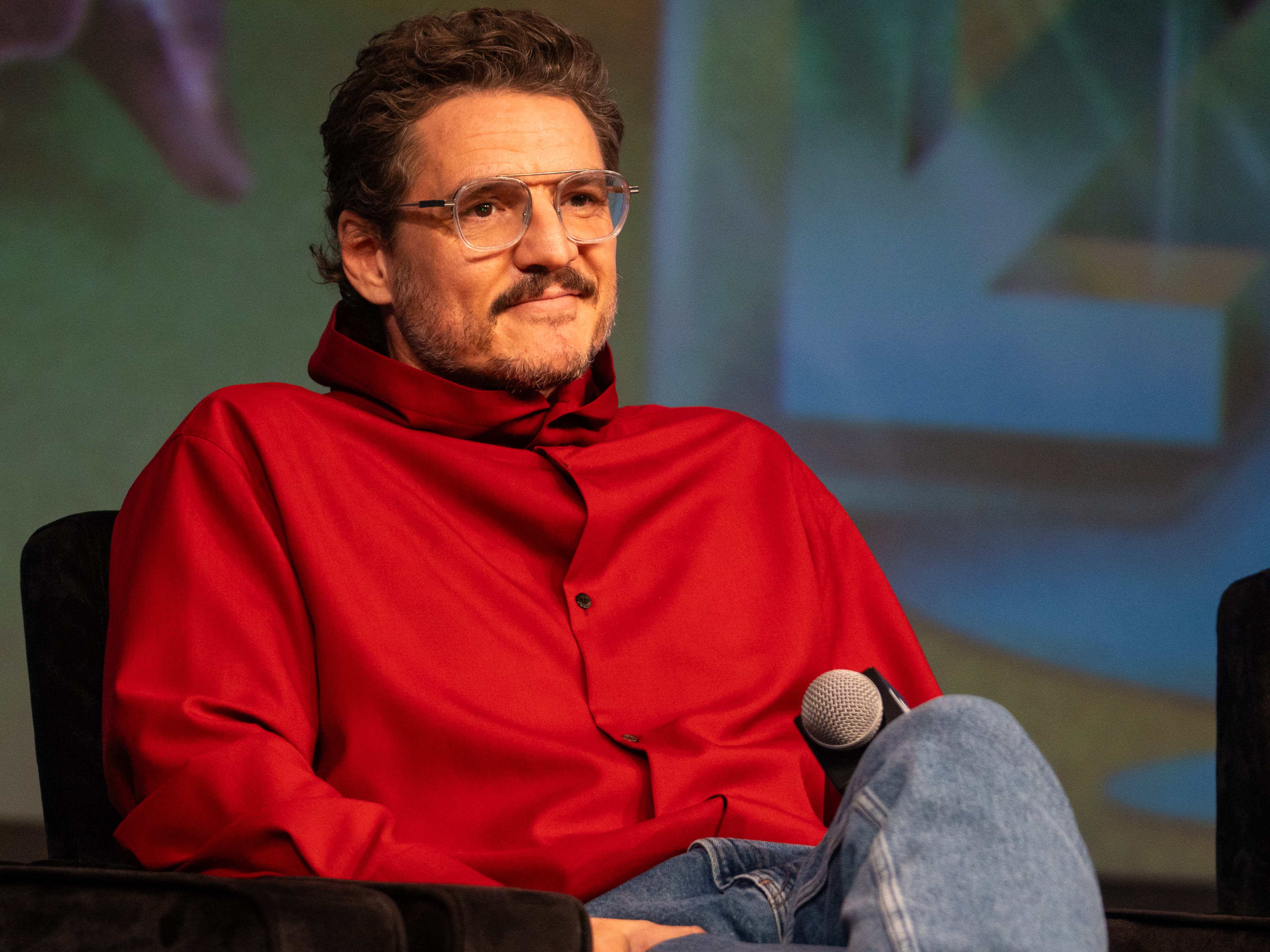 Pedro Pascal wearing a red jacket